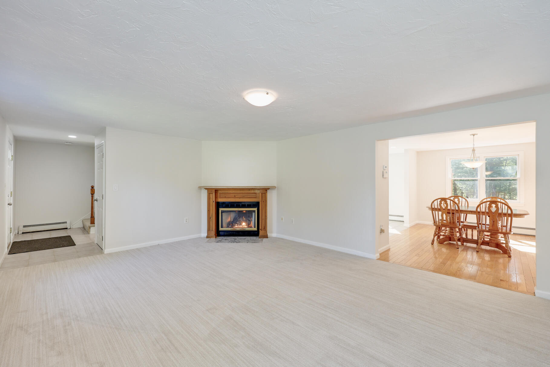 7 Yearling Run Road Buzzards Bay, MA 02532 - Photo 9 of 55 an empty room with furniture and large windows