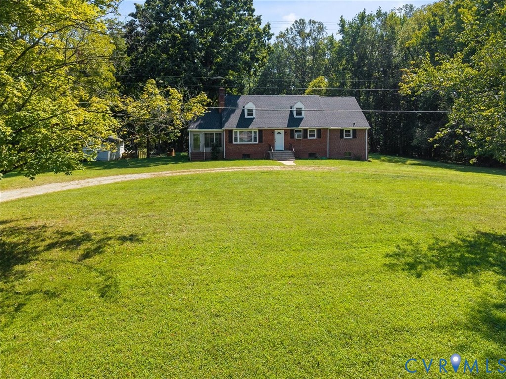 3577 Old Buckingham Road Powhatan, VA 23139 - Photo 3 of 36 Brick exterior residence featuring a gabled roof,