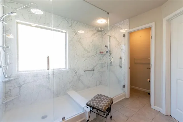 a bathroom with a bathtub and a shower