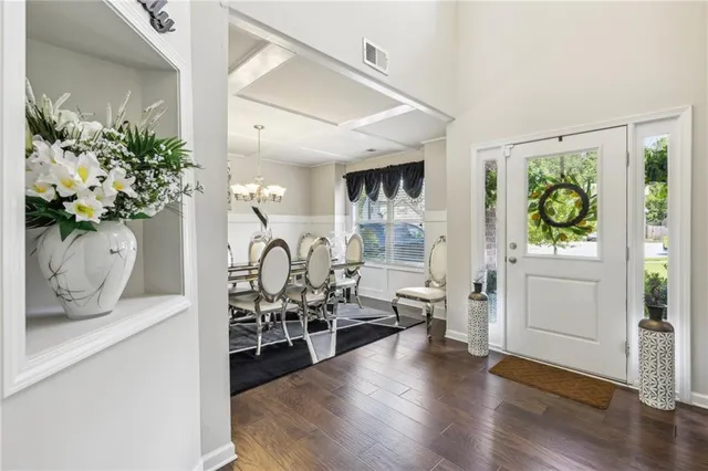 a view of an entryway with wooden floor