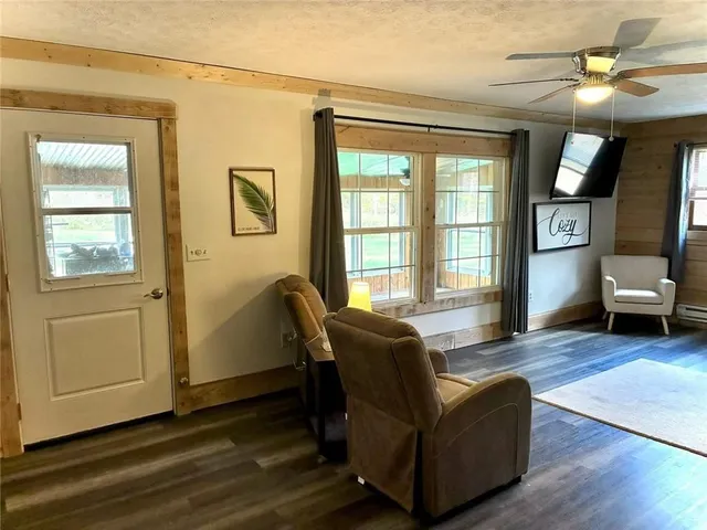 a living room with furniture and a window