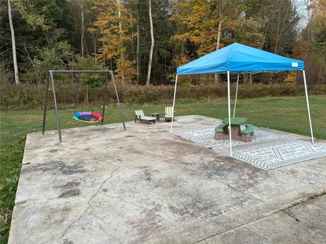 a view of a park with large trees