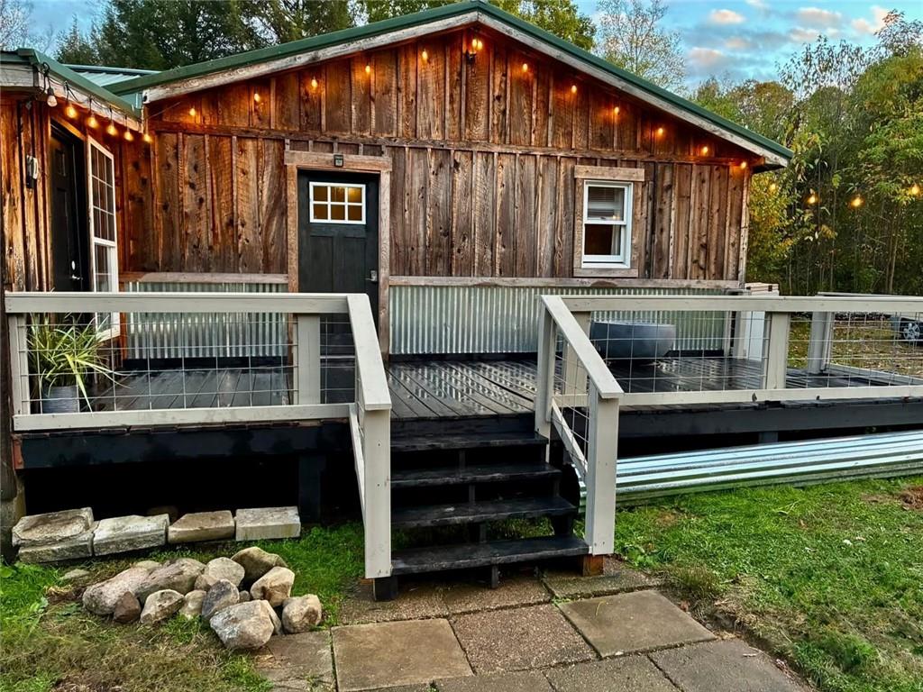123 Hemlock Lane Utica, PA 16362 - Photo 5 of 30 a front view of a house with a garden