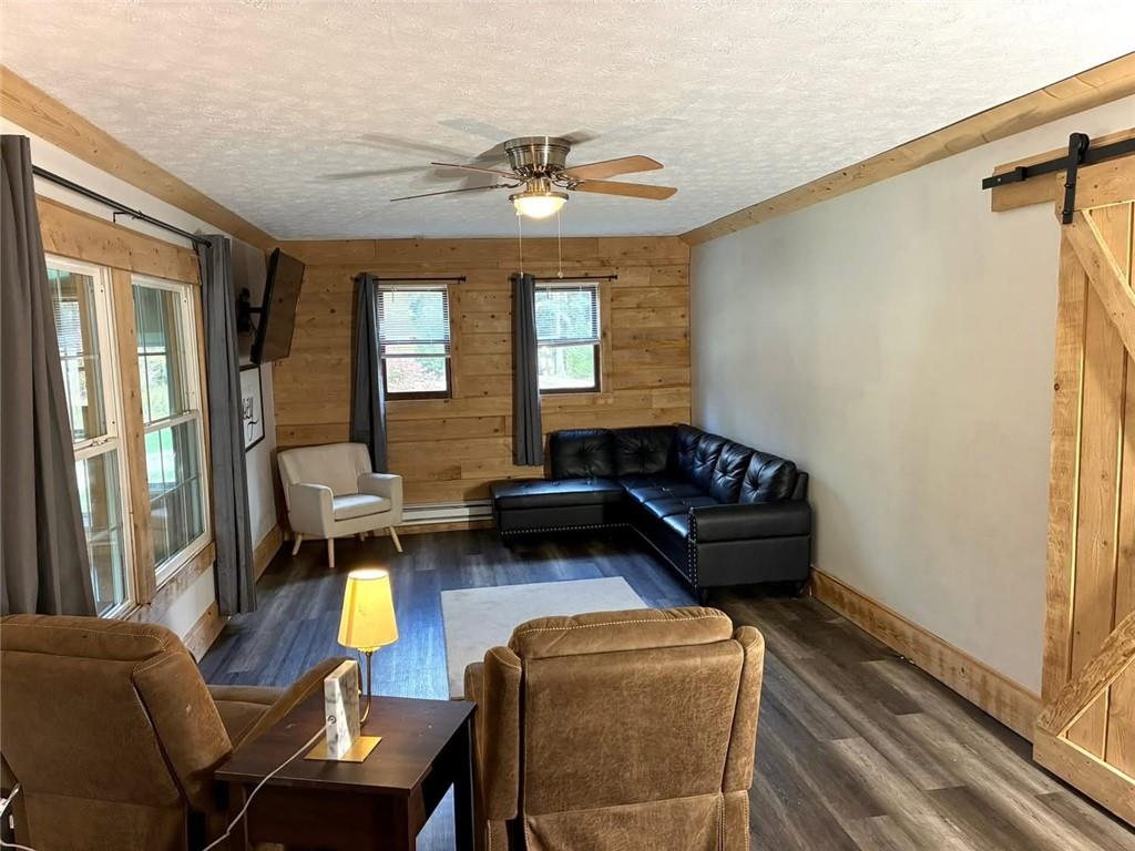123 Hemlock Lane Utica, PA 16362 - Photo 10 of 30 a living room with furniture and wooden floor
