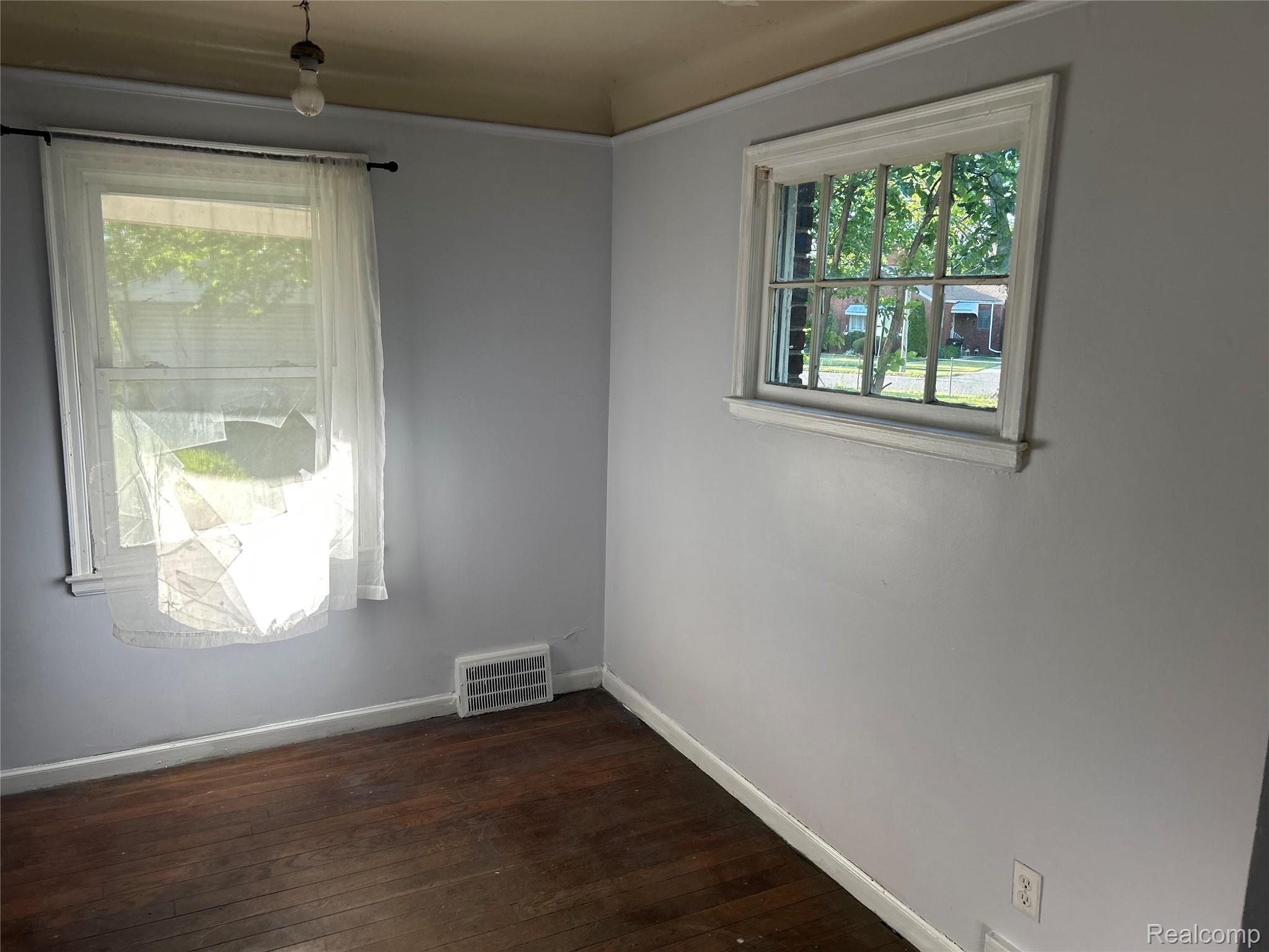 12641 Kelly Road Detroit, MI 48224 - Photo 5 of 40 Hardwood flooring with light gray walls and white trim