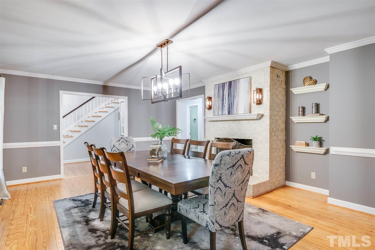 12608 Old Creedmoor Road Raleigh, NC 27613 - Photo 13 of 30 a view of a dining room with furniture and chandelier