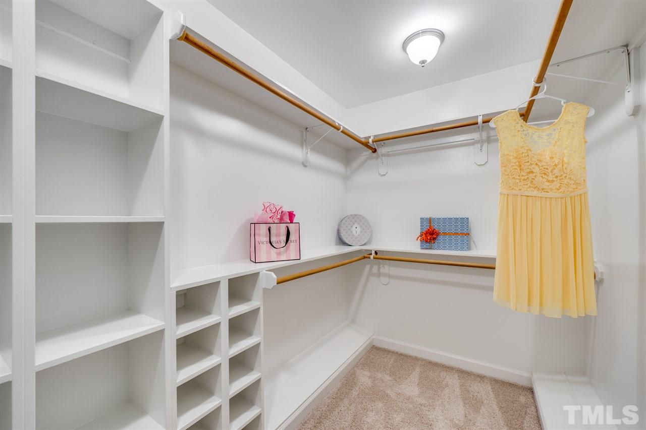 12608 Old Creedmoor Road Raleigh, NC 27613 - Photo 15 of 30 a storage room with cabinets