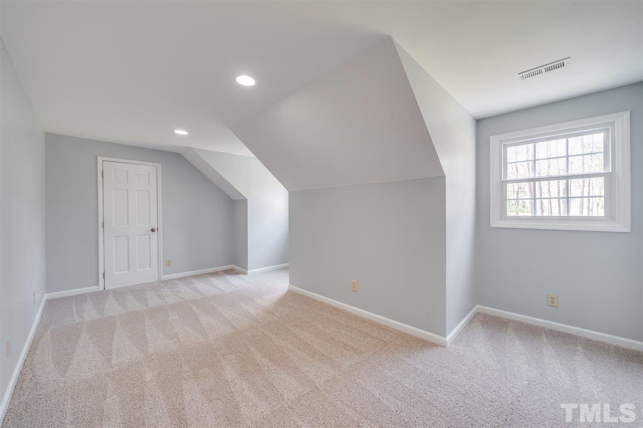 12608 Old Creedmoor Road Raleigh, NC 27613 - Photo 19 of 30 a view of an empty room with a window