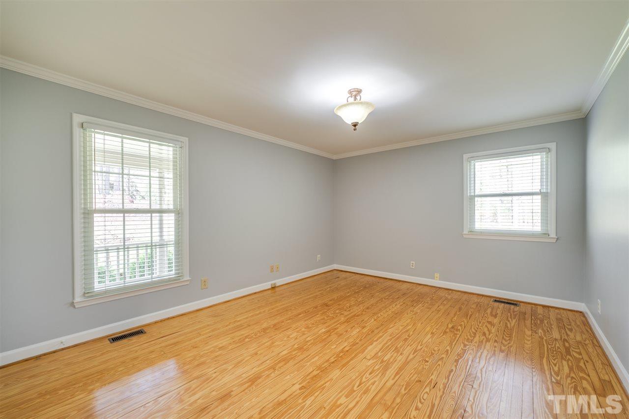 12608 Old Creedmoor Road Raleigh, NC 27613 - Photo 20 of 30 wooden floor in an empty room with a window