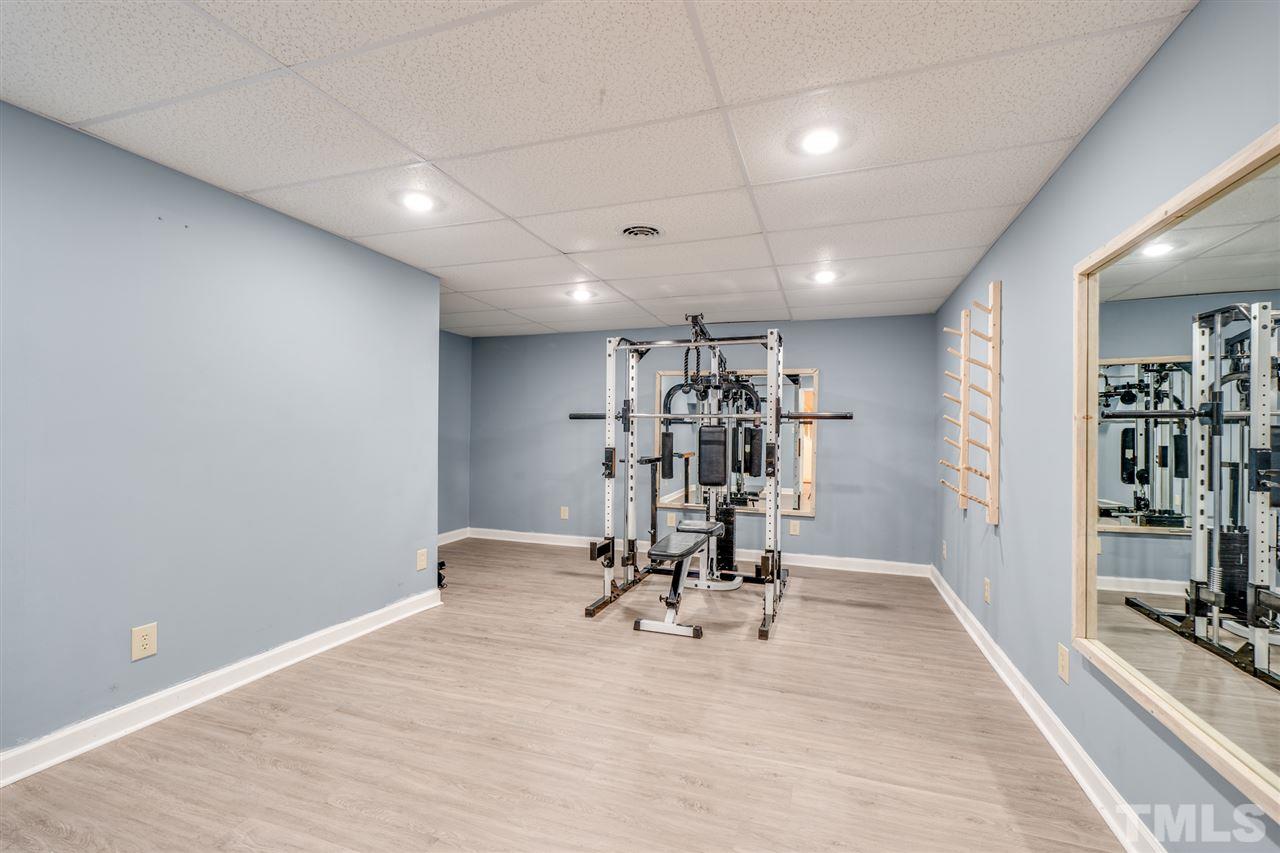 12608 Old Creedmoor Road Raleigh, NC 27613 - Photo 23 of 30 a view of a room with gym equipment