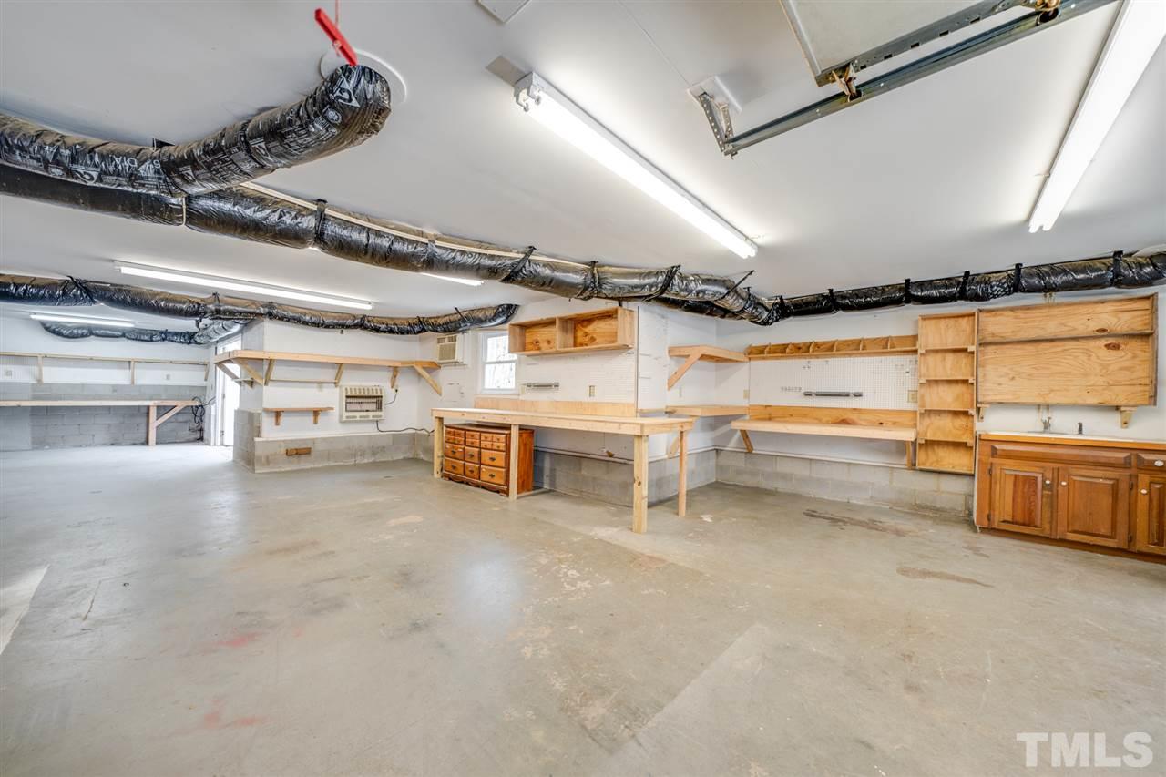 12608 Old Creedmoor Road Raleigh, NC 27613 - Photo 25 of 30 a view of a room with storage and racks