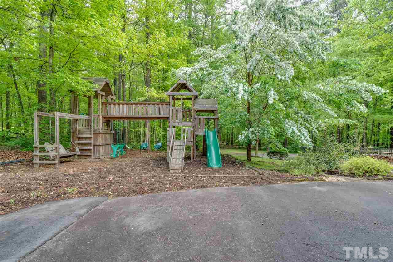 12608 Old Creedmoor Road Raleigh, NC 27613 - Photo 29 of 30 a view of a house with a yard and plants