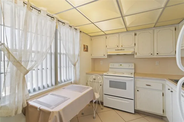 a kitchen that has a cabinets and a stove
