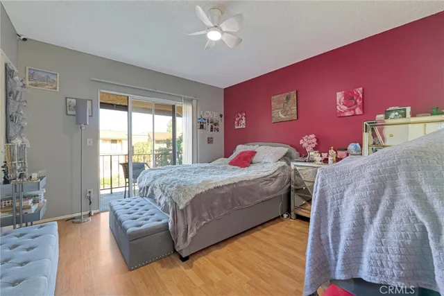 a bedroom with a large bed and a couch