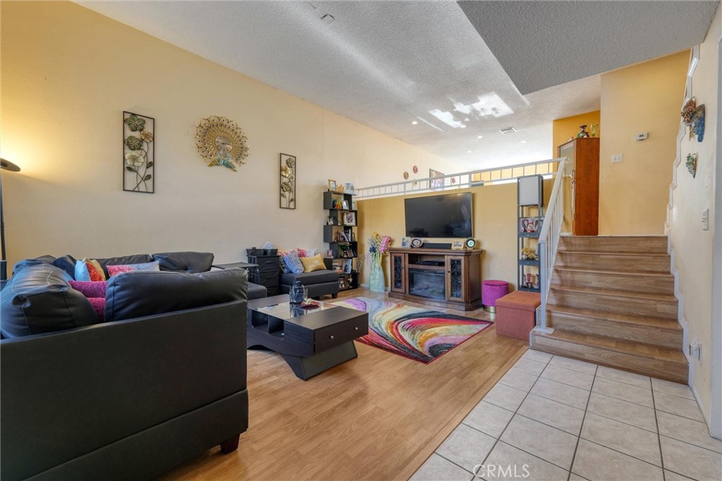 19545 Sherman Way, Unit 97 Reseda, CA 91335 - Photo 2 of 26 a living room with furniture and a flat screen tv