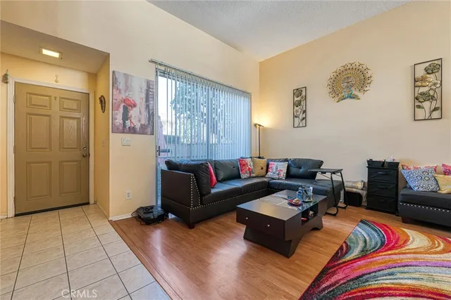 a living room with patio furniture and a window
