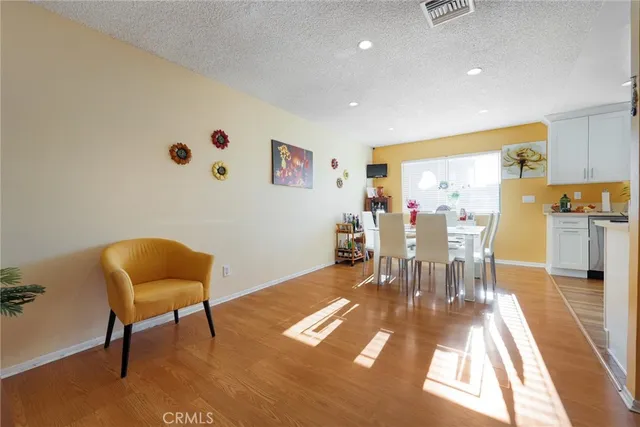 a view of a livingroom with furniture and a workspace