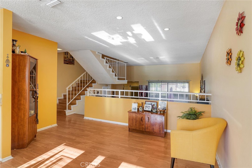 19545 Sherman Way, Unit 97 Reseda, CA 91335 - Photo 7 of 26 a view of entryway and hall with wooden floor