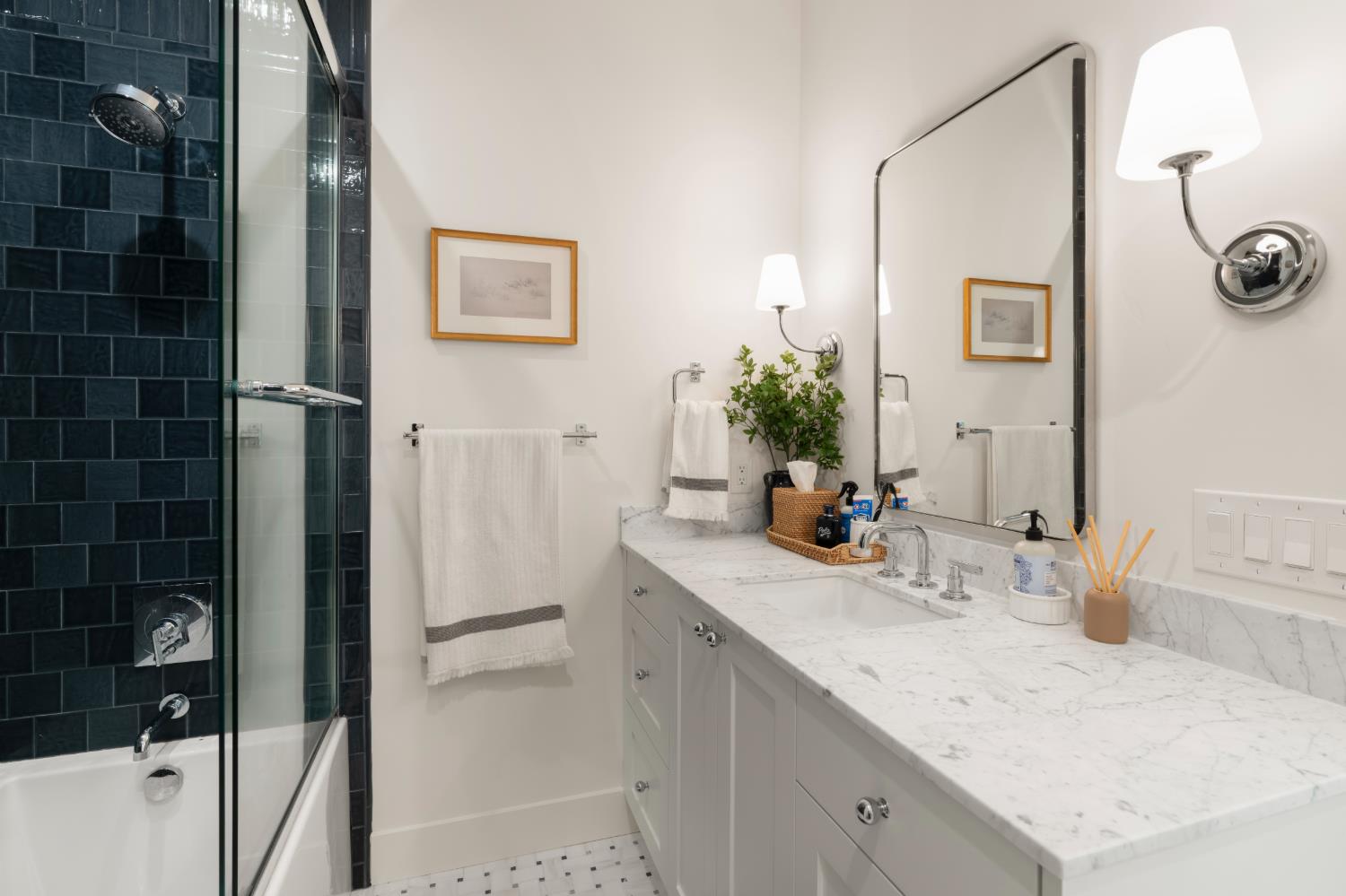 7697 Horseshoe Bar Road Loomis, CA 95650 - Photo 32 of 76 a bathroom with a sink and a mirror