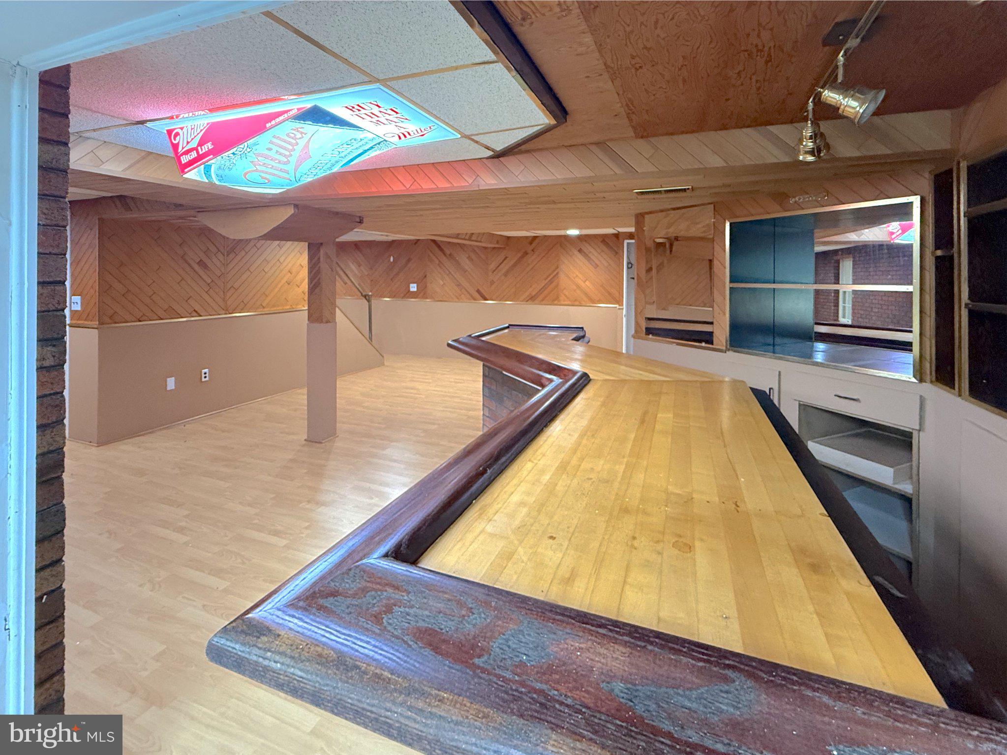 9006 Sidehill Road Ellicott City, MD 21042 - Photo 42 of 53 Spacious basement bar with wood accents.