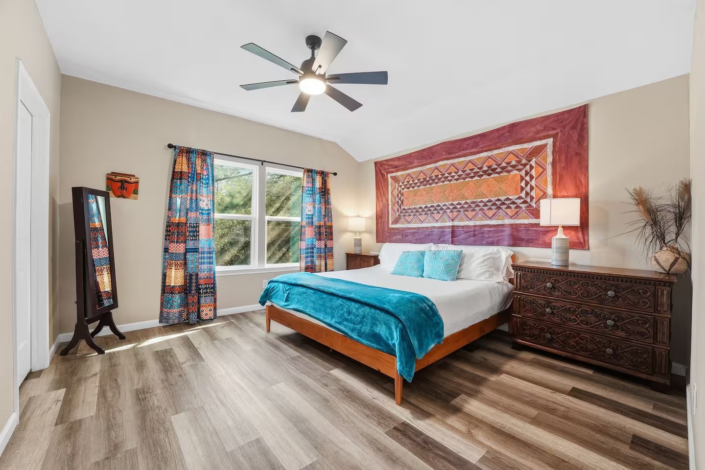 201 Winfield Thicket Road Bastrop, TX 78602 - Photo 26 of 36 a bedroom with a bed and a chandelier
