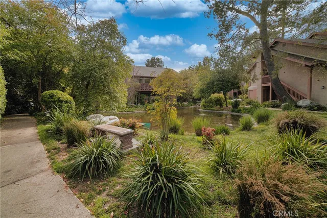 a view of a lake with a building in the background