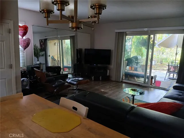 a living room with fireplace furniture and a flat screen tv