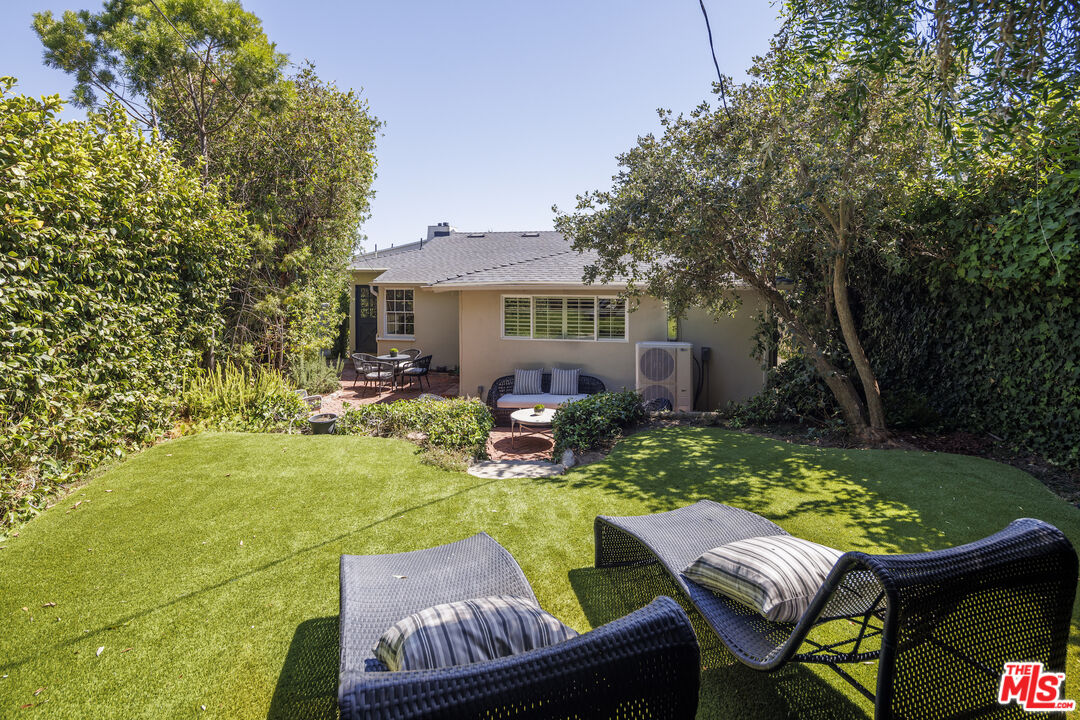 10613 Rochester Avenue Los Angeles, CA 90024 - Photo 26 of 27 a view of backyard of house with seating space