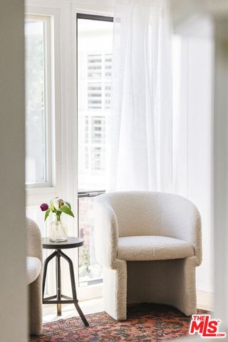 a living room with furniture and window