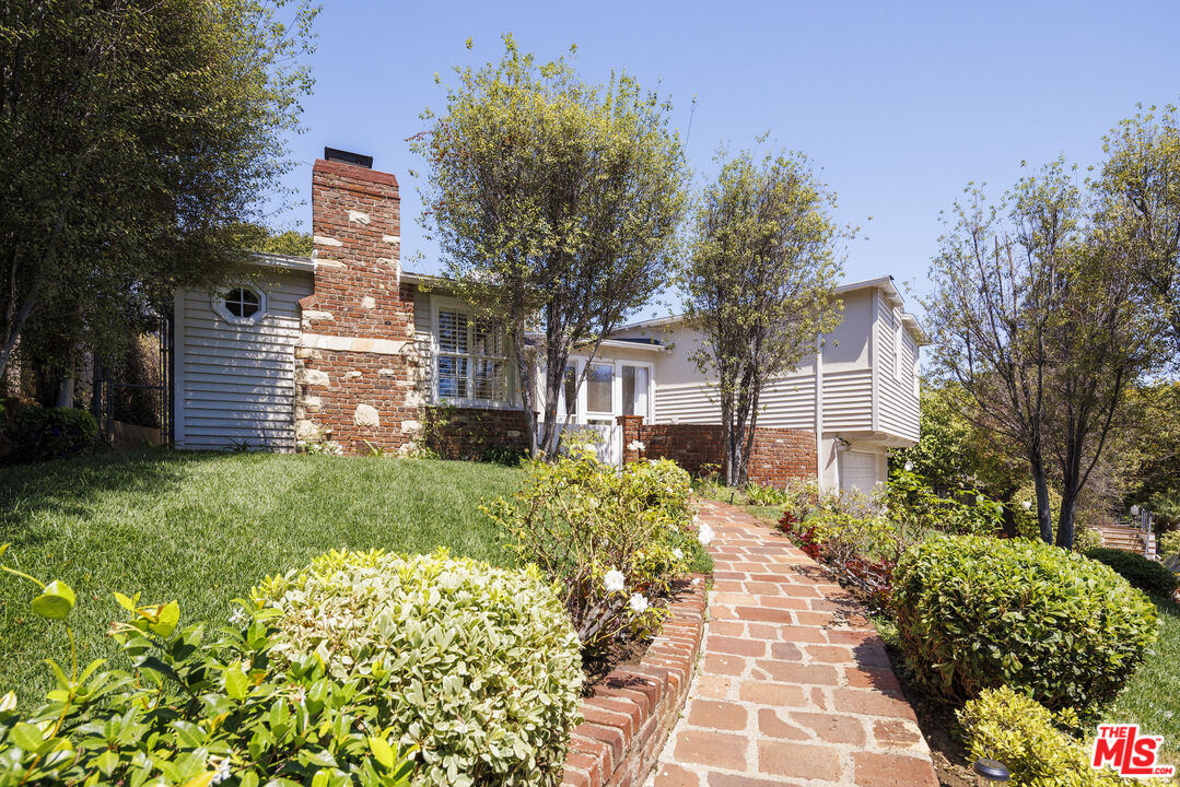 10613 Rochester Avenue Los Angeles, CA 90024 - Photo 6 of 27 a view of a pathway with flower garden