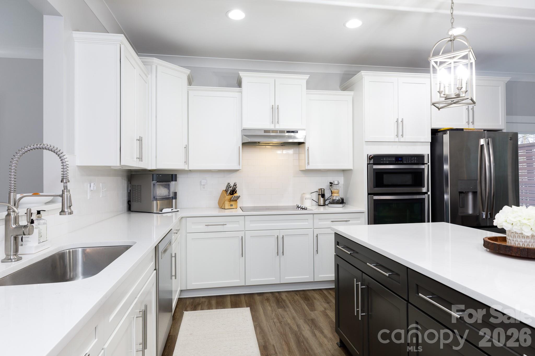 2172 Bluebell Way Tega Cay, SC 29708 - Photo 11 of 40 a kitchen with a sink cabinets and stainless steel appliances