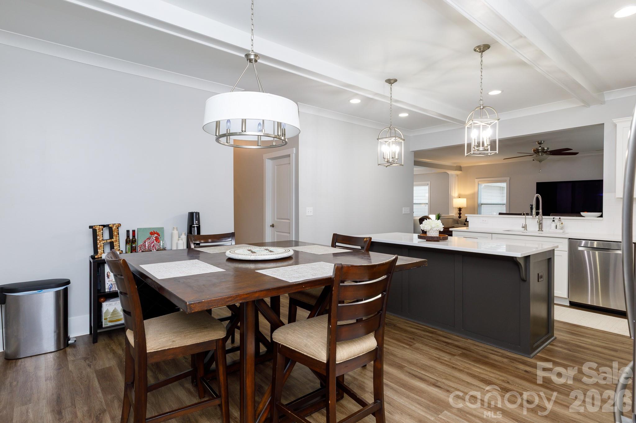 2172 Bluebell Way Tega Cay, SC 29708 - Photo 16 of 40 a view of a dining room with furniture and wooden floor