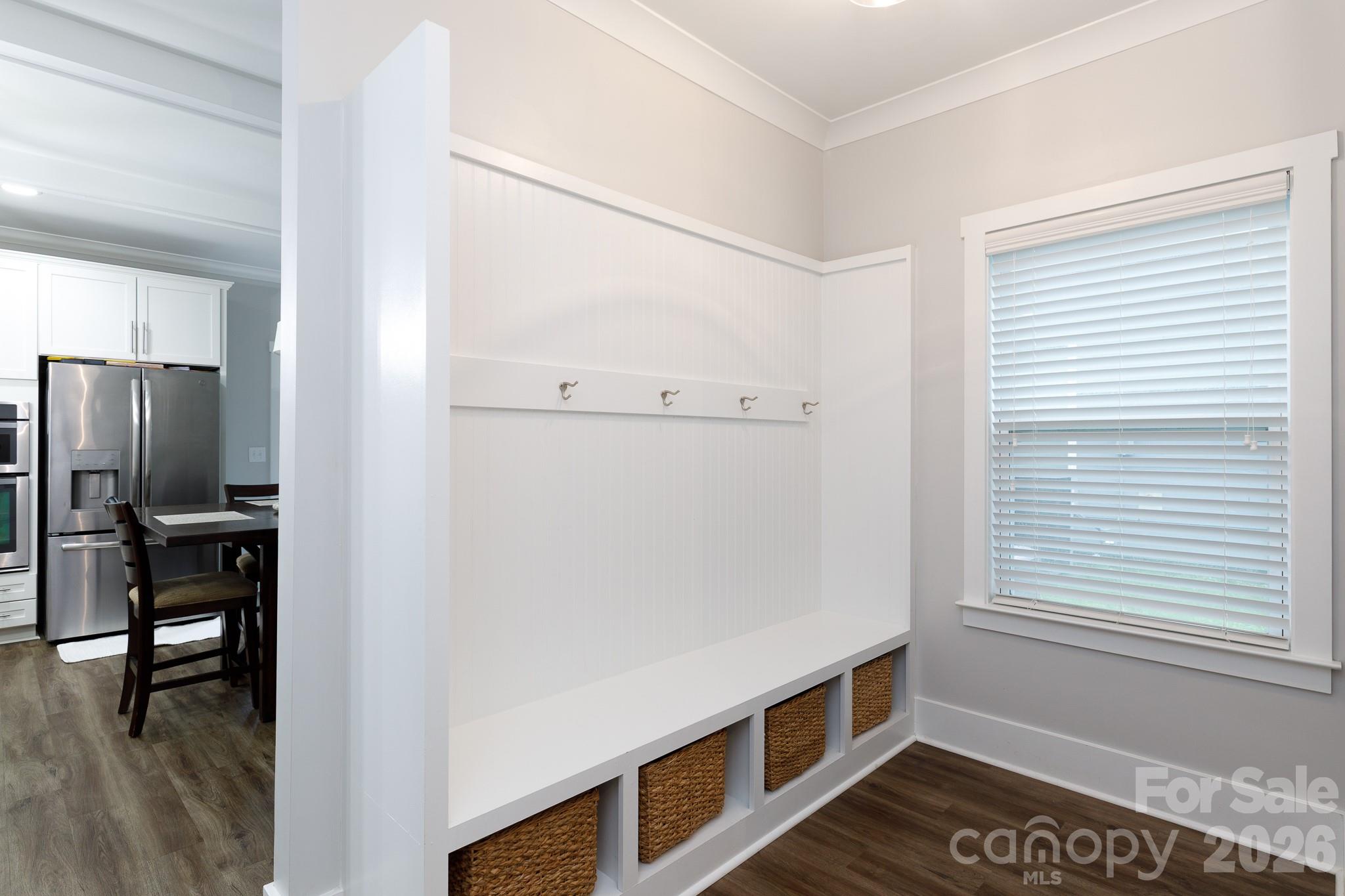 2172 Bluebell Way Tega Cay, SC 29708 - Photo 17 of 40 a view of an empty room with window and wooden floor