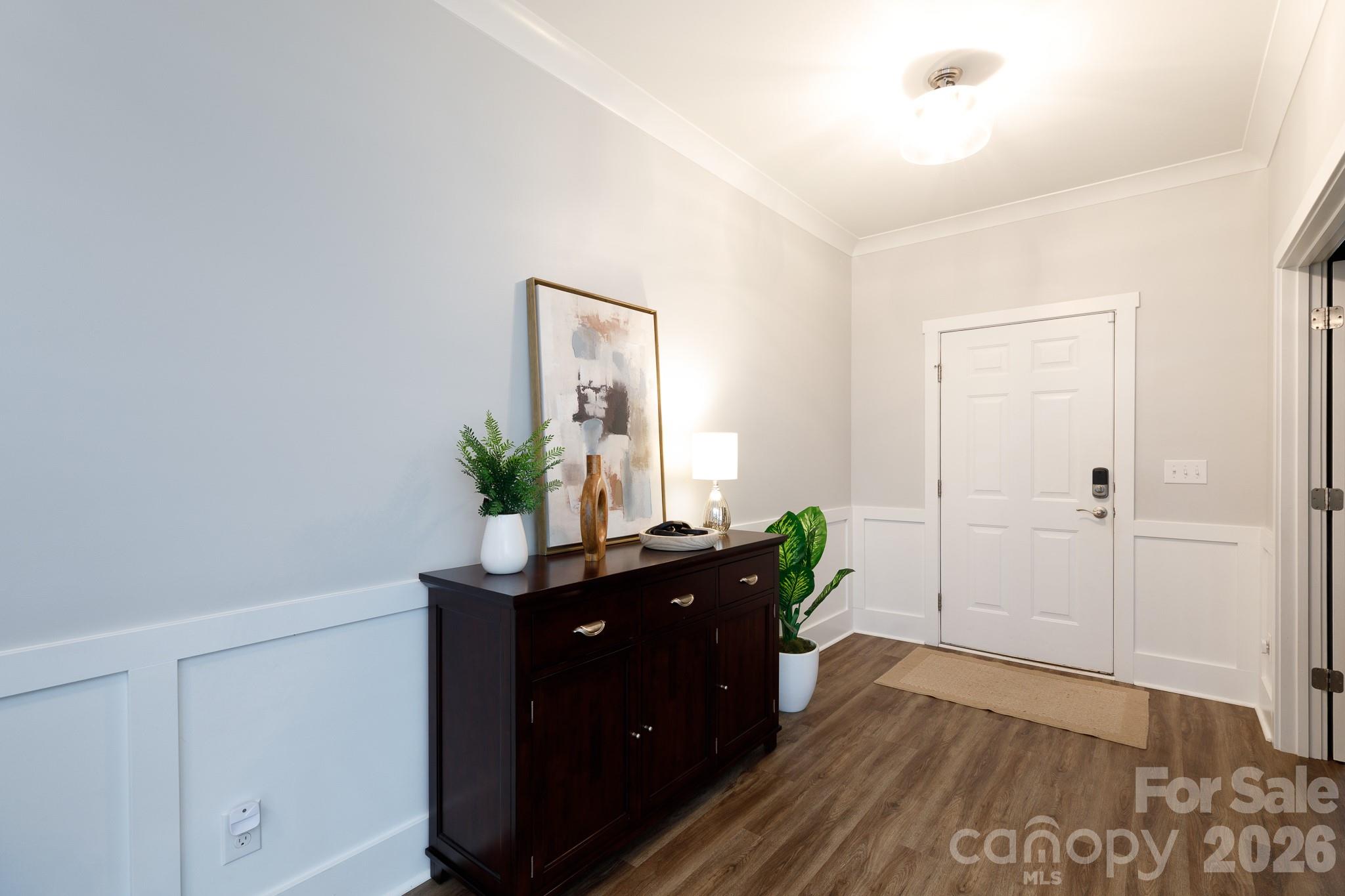 2172 Bluebell Way Tega Cay, SC 29708 - Photo 2 of 40 a room with wooden floor and potted plant