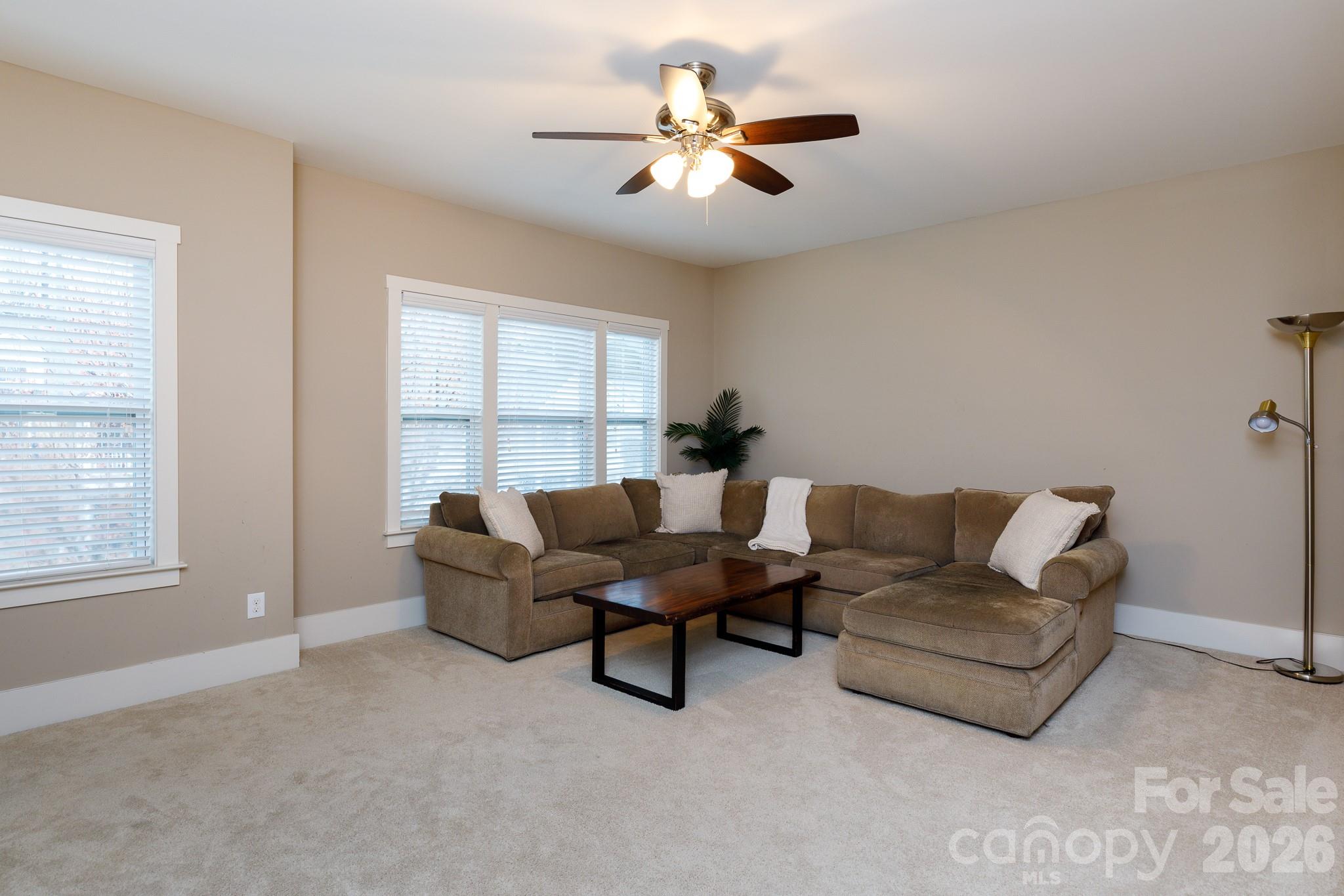 2172 Bluebell Way Tega Cay, SC 29708 - Photo 28 of 40 a living room with furniture and a window