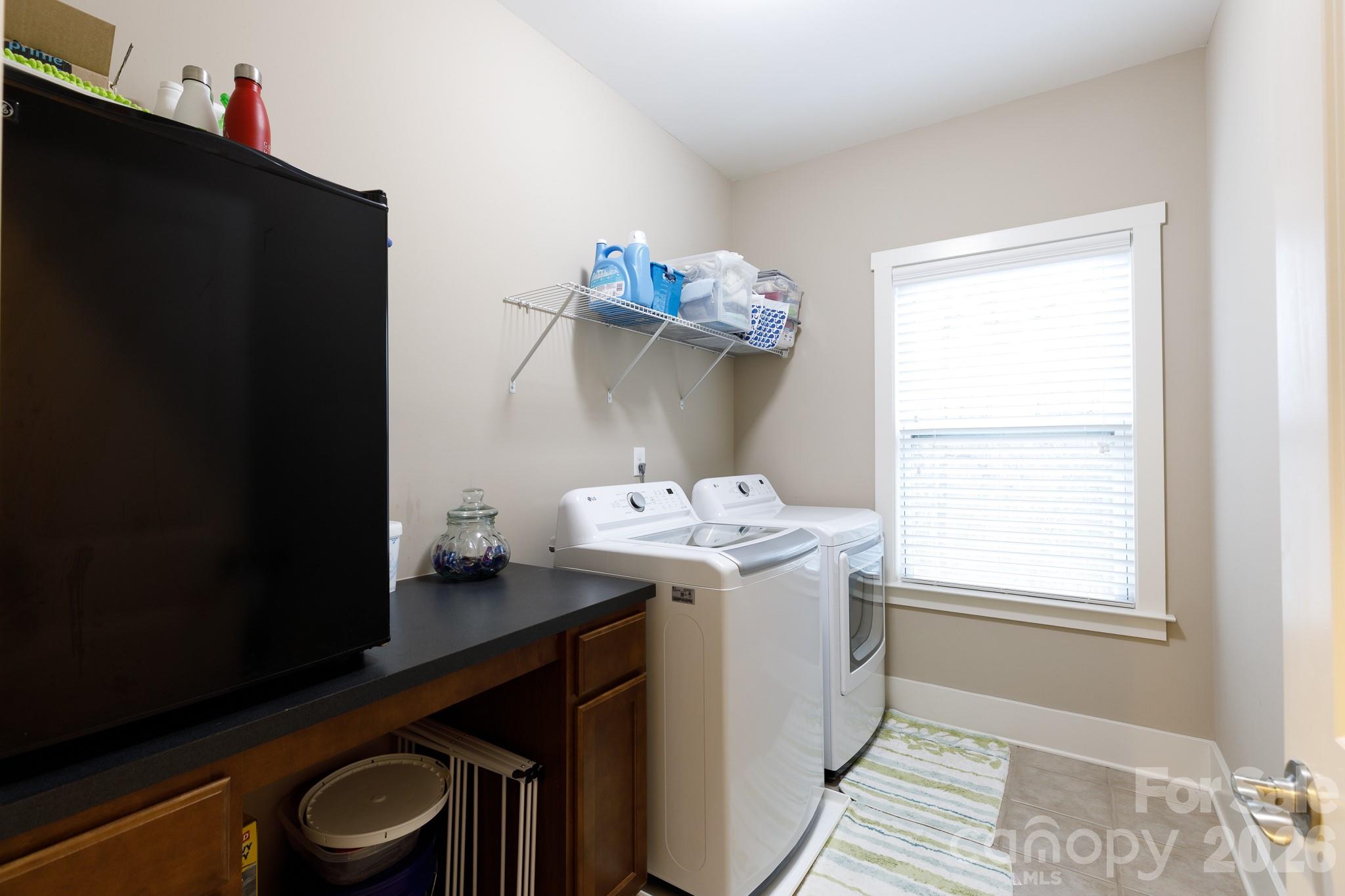 2172 Bluebell Way Tega Cay, SC 29708 - Photo 34 of 40 a utility room with dryer and washer