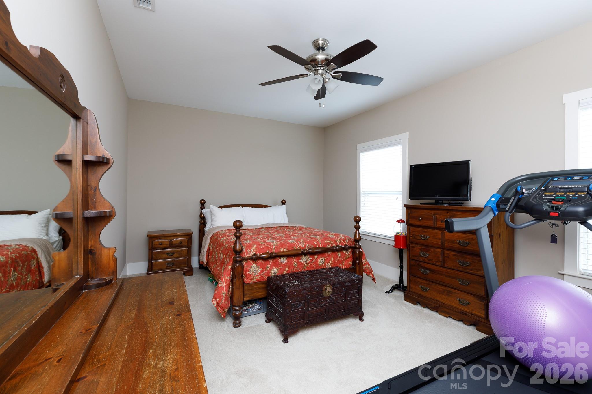 2172 Bluebell Way Tega Cay, SC 29708 - Photo 35 of 40 a bedroom with bed and flat screen tv