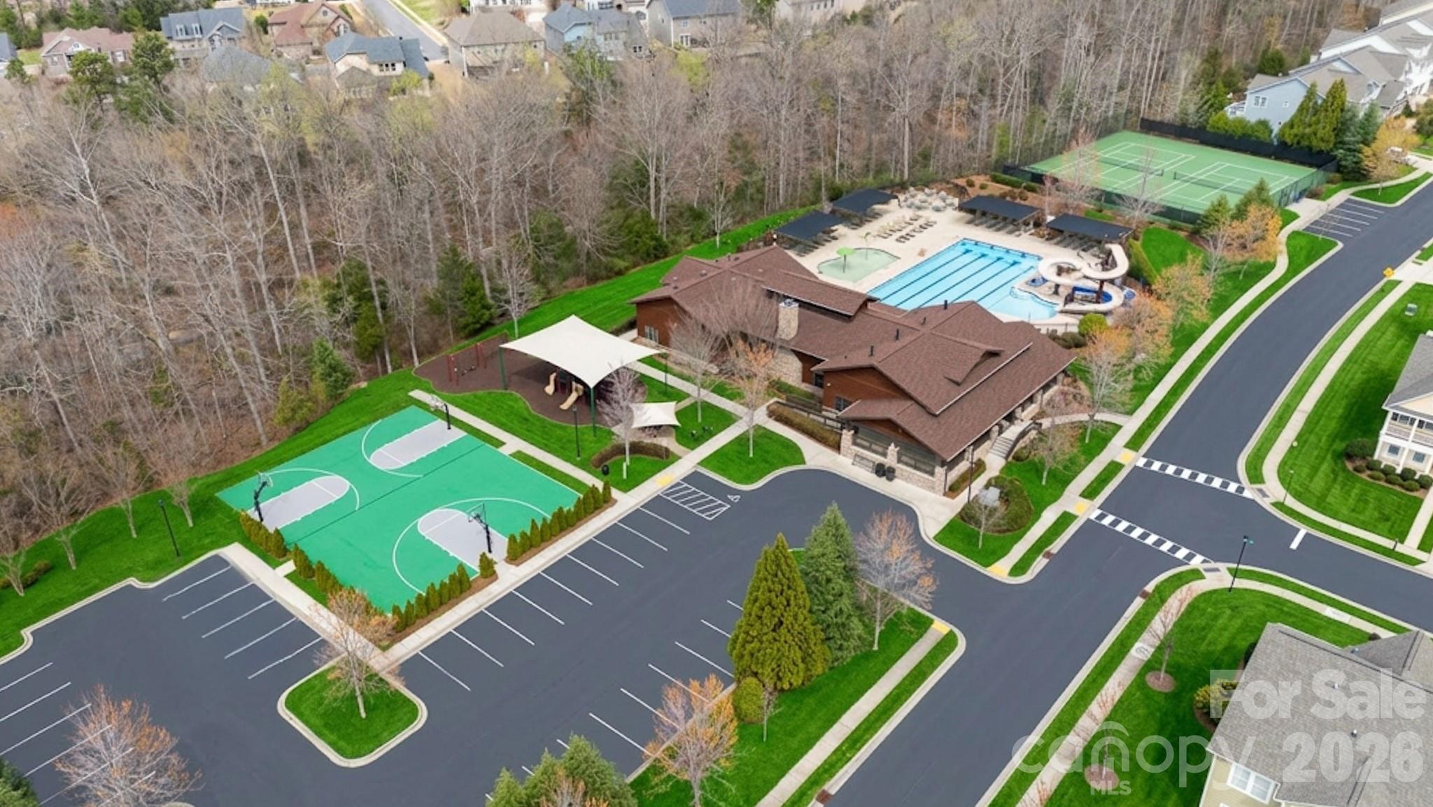 2172 Bluebell Way Tega Cay, SC 29708 - Photo 39 of 40 an aerial view of a swimming pool patio and outdoor seating