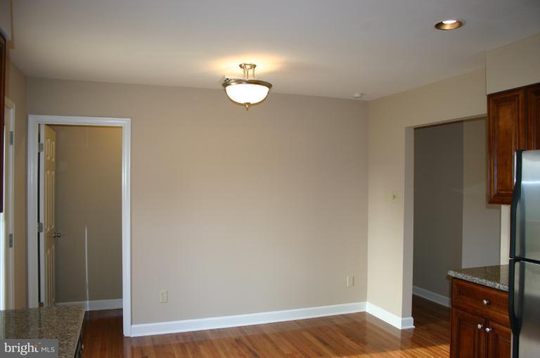 13163 Kaiser Ridge Road Hagerstown, MD 21740 - Photo 14 of 29 a view of a kitchen with refrigerator and wooden floor