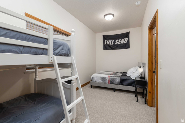5168 Fairview Loop, Unit C604 Eden, UT 84310 - Photo 35 of 53 Bedroom featuring light colored carpet and baseboards
