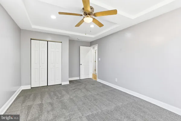 a view of an empty room with stairs