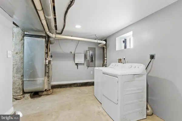 a view of a storage & utility room with washer and dryer