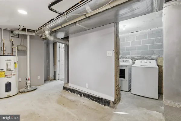 a view of a porch with a door and wooden fence