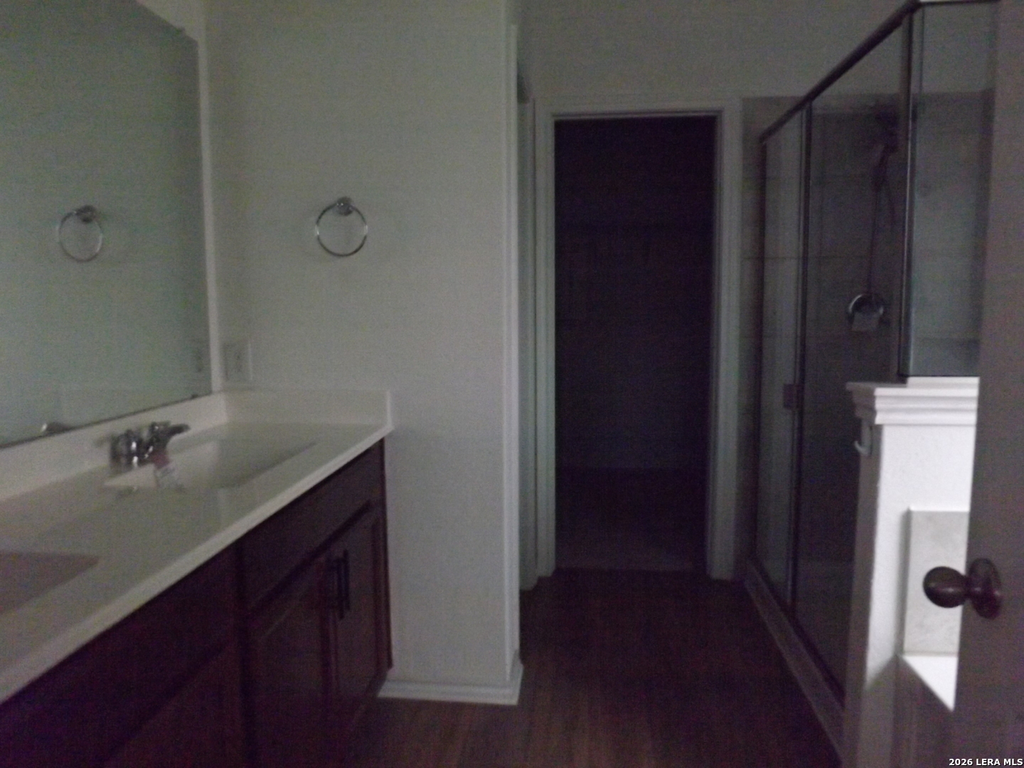 6835 Alaskan Wy. Converse, TX 78109 - Photo 7 of 22 a bathroom with a sink and mirror
