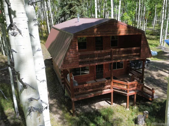 a view of a wooden chairs in the patio