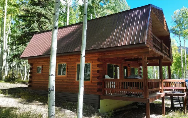 a view of balcony with wooden floor and fence