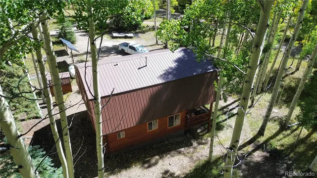 a kitchen with granite countertop a stove a sink and a cabinets