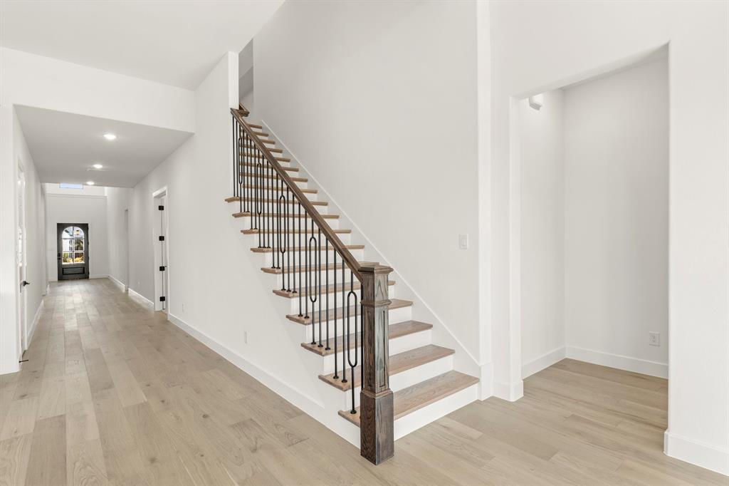 4711 Belo Drive Prosper, TX 75078 - Photo 5 of 40 a view of entryway and hall with wooden floor