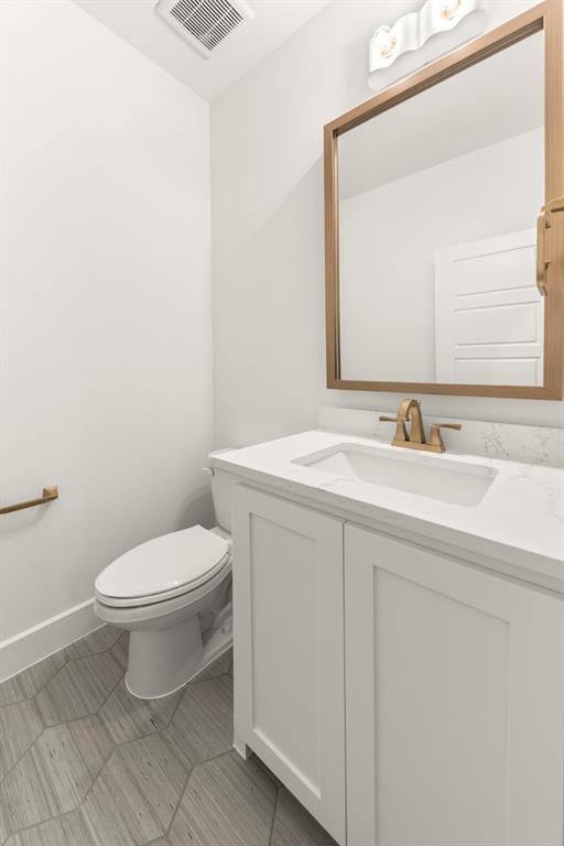 4711 Belo Drive Prosper, TX 75078 - Photo 8 of 40 a bathroom with a sink a toilet and mirror