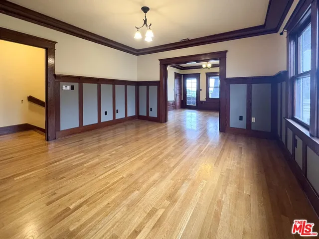 a view of gallery with wooden floor